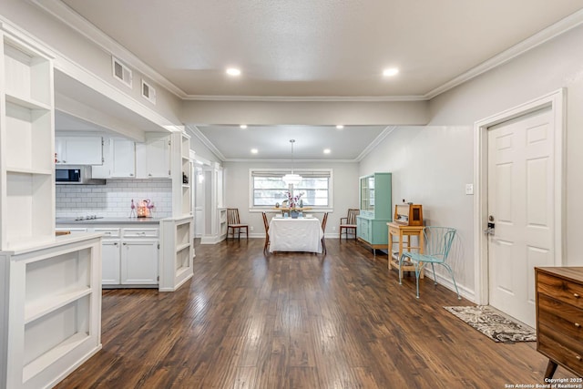 kitchen featuring tasteful backsplash, white cabinets, dark wood finished floors, light countertops, and open shelves