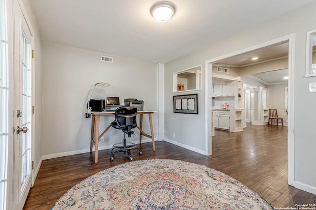 office with dark wood-type flooring, visible vents, and baseboards