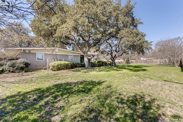 view of yard featuring fence