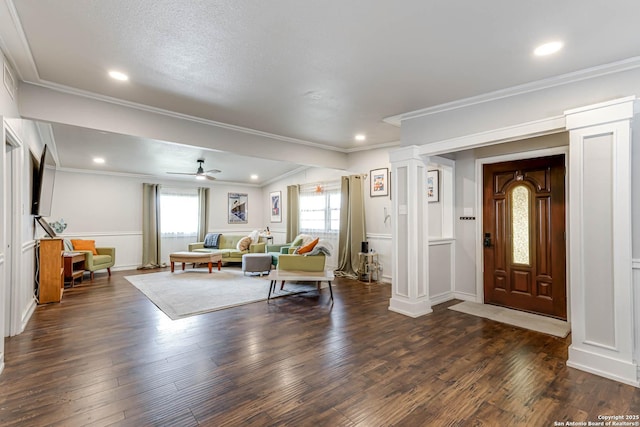 entryway with recessed lighting, dark wood-style flooring, crown molding, and ornate columns