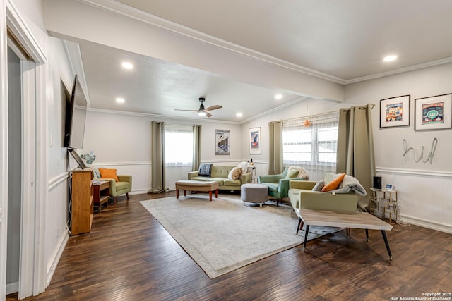 living room featuring ornamental molding, dark wood-type flooring, and wainscoting