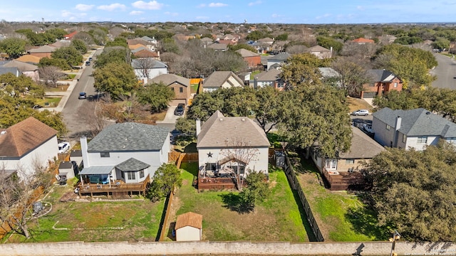 birds eye view of property with a residential view