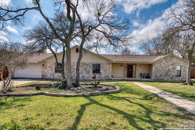 view of front of property featuring an attached garage, concrete driveway, stone siding, a front lawn, and a chimney