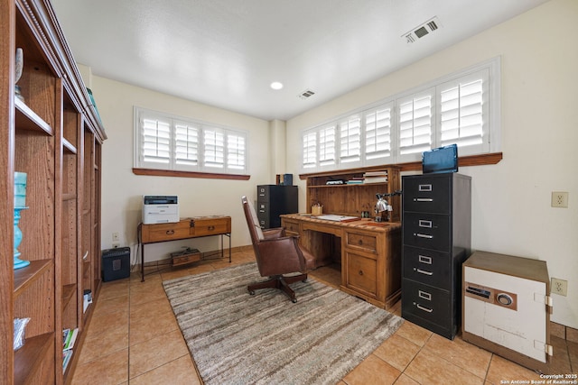 office space featuring light tile patterned floors and visible vents