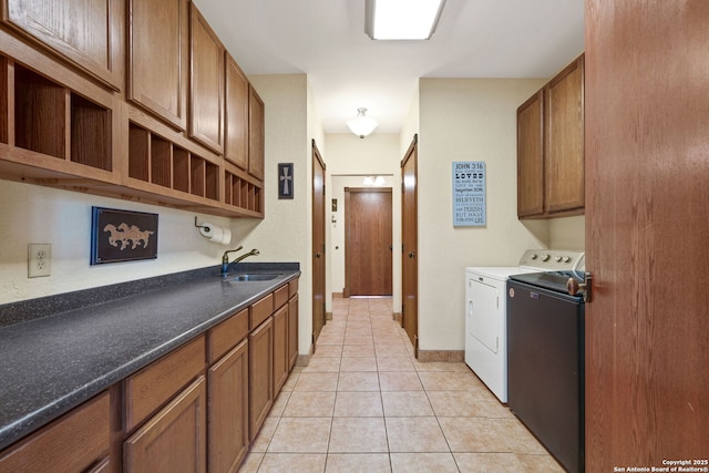 kitchen with open shelves, brown cabinetry, independent washer and dryer, and a sink