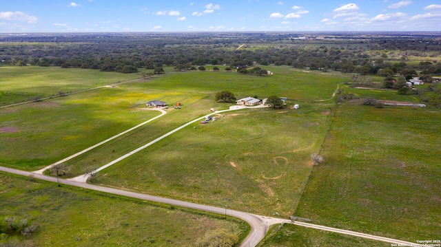 birds eye view of property with a rural view