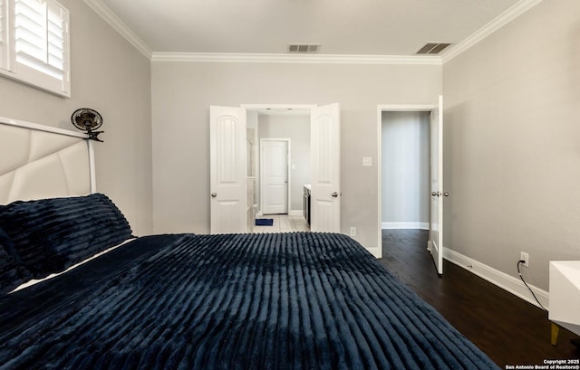 unfurnished bedroom with baseboards, visible vents, wood finished floors, and ornamental molding