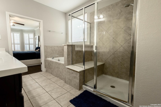 ensuite bathroom featuring ensuite bath, a stall shower, tile patterned flooring, and a bath