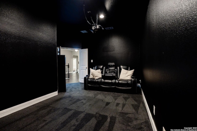 home theater room with carpet, visible vents, and baseboards