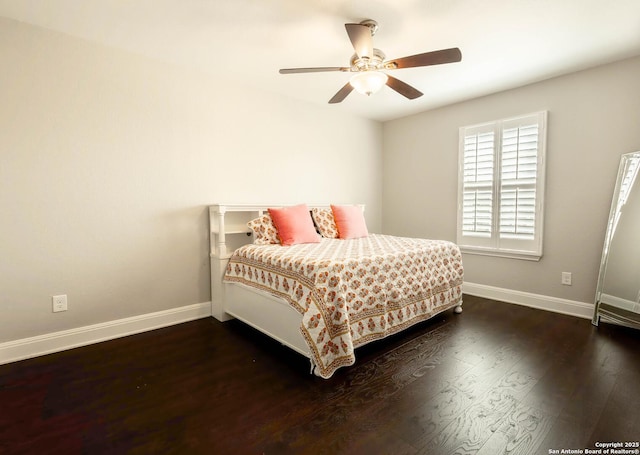 bedroom with dark wood-type flooring, baseboards, and a ceiling fan