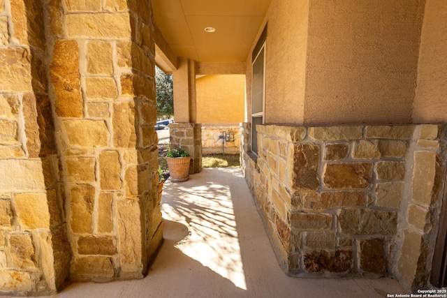 exterior space featuring stone siding