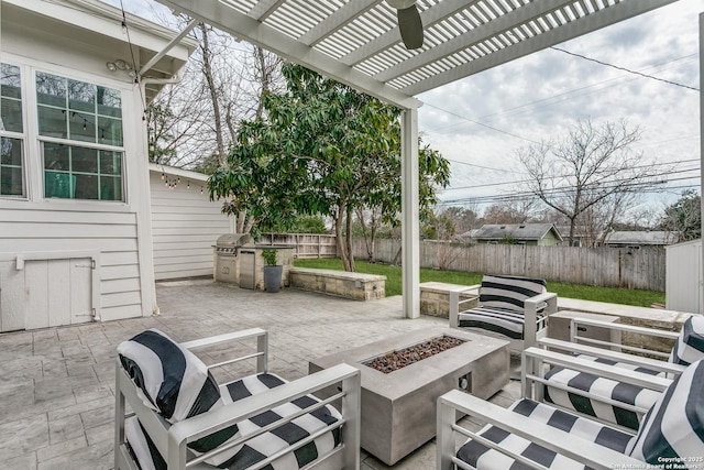 view of patio / terrace featuring a fire pit, grilling area, a fenced backyard, and a pergola