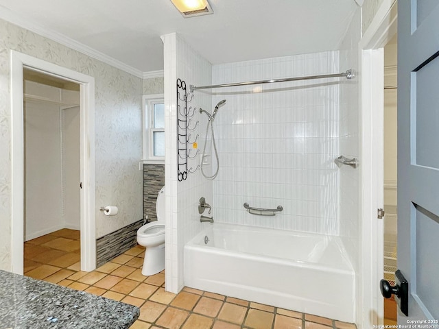 bathroom featuring toilet, visible vents, tub / shower combination, tile patterned floors, and crown molding