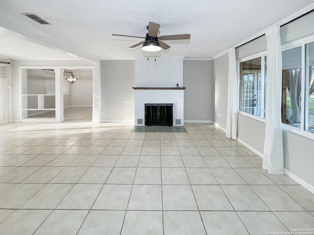 unfurnished living room featuring light tile patterned floors, visible vents, a ceiling fan, a brick fireplace, and baseboards