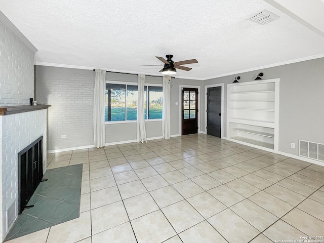 unfurnished living room featuring built in features, visible vents, crown molding, and a textured ceiling