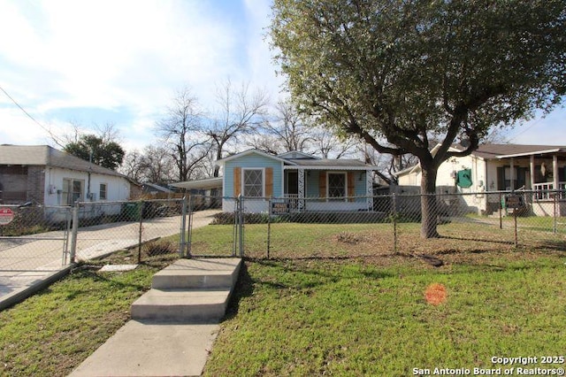 view of front facade with driveway, a fenced front yard, an attached carport, a gate, and a front lawn