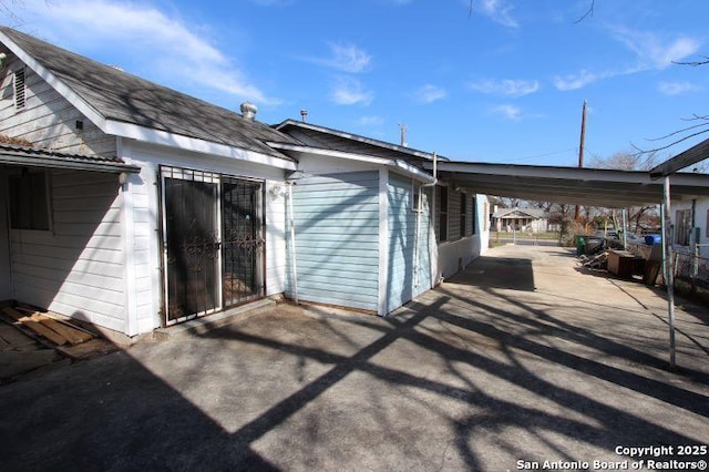 exterior space featuring a carport