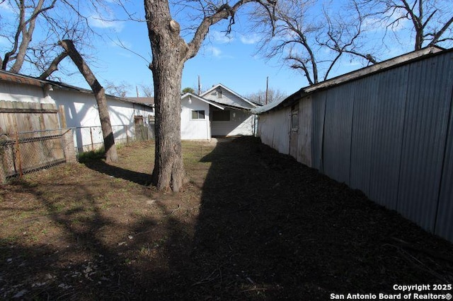 view of side of property with fence