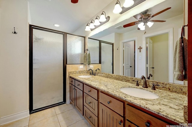 full bathroom featuring visible vents, a sink, a shower stall, and tile patterned floors