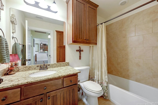 full bath with visible vents, shower / bathtub combination with curtain, toilet, vanity, and tile patterned flooring