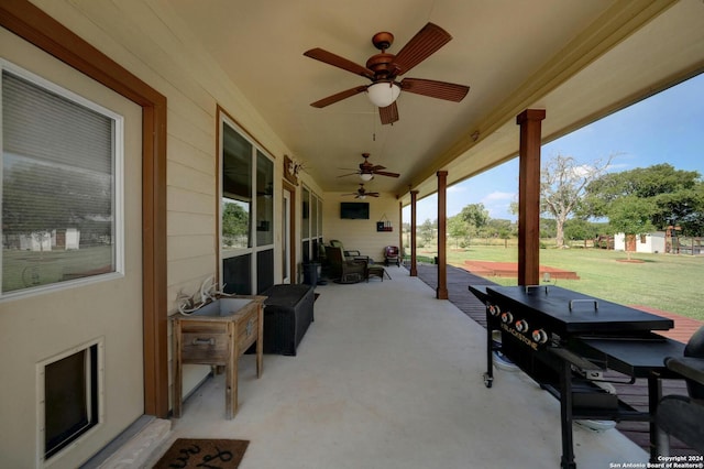 view of patio featuring ceiling fan and an outdoor living space