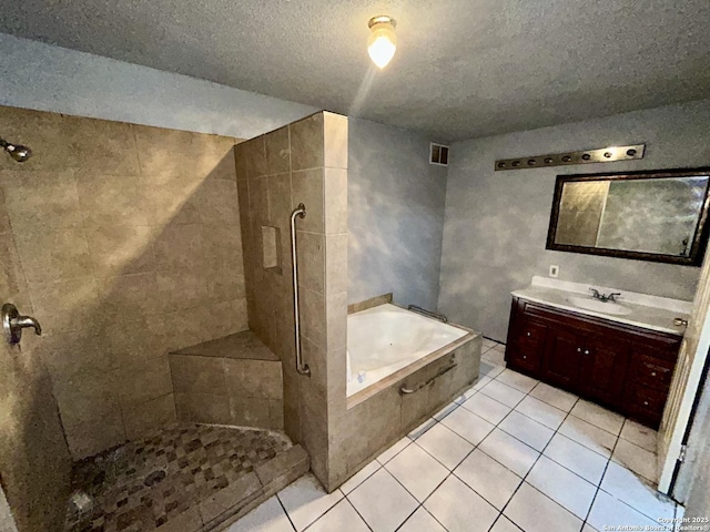 bathroom with visible vents, tiled shower, tile patterned floors, vanity, and a bath