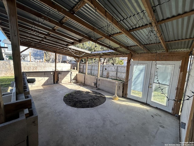 view of patio / terrace with french doors and fence