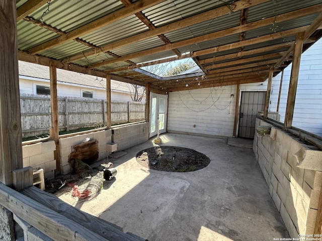 view of patio featuring fence