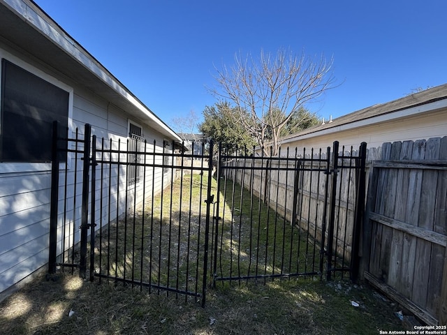 view of gate featuring fence