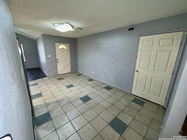 foyer featuring a textured ceiling