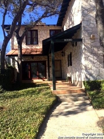 view of front facade featuring stone siding