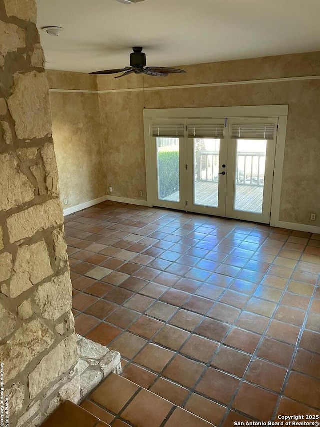 spare room with ceiling fan, baseboards, french doors, and tile patterned floors