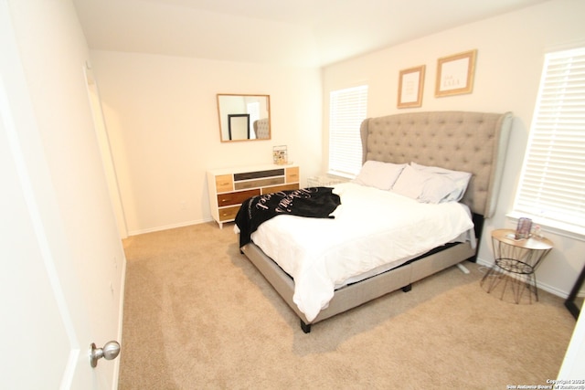 carpeted bedroom with baseboards