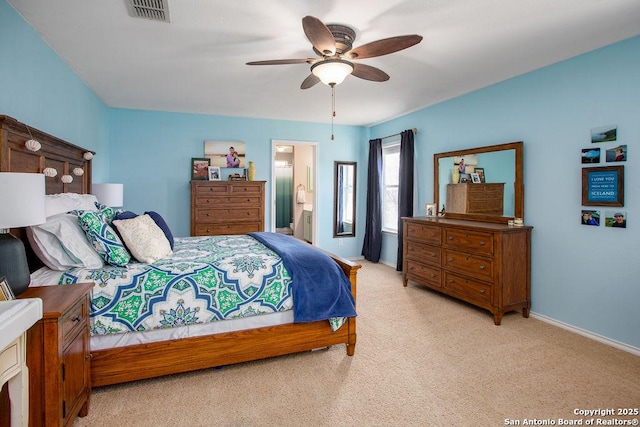 bedroom featuring light carpet, baseboards, visible vents, a ceiling fan, and connected bathroom