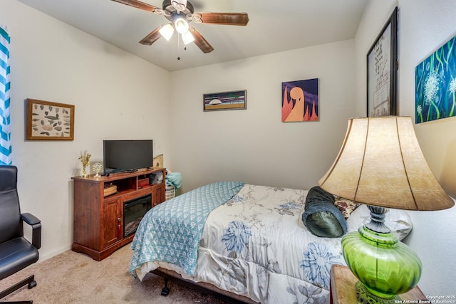 bedroom with carpet floors, baseboards, and a ceiling fan