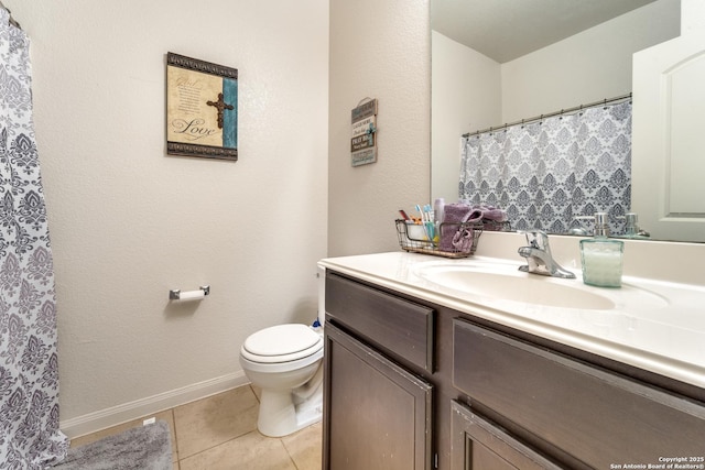 bathroom featuring a shower with shower curtain, toilet, vanity, tile patterned flooring, and baseboards