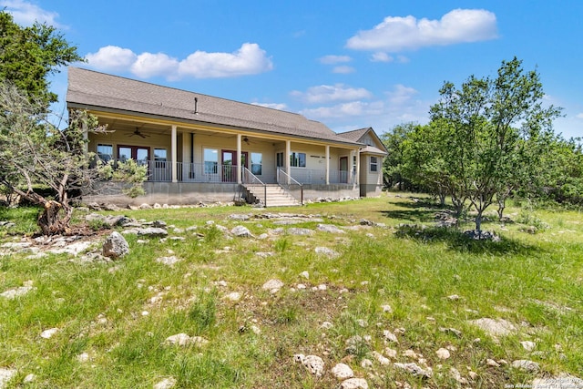 rear view of property with ceiling fan