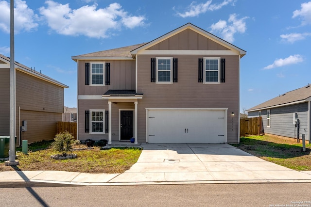 traditional home featuring board and batten siding, concrete driveway, fence, and a garage