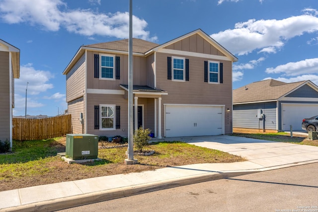 traditional-style house with an attached garage, cooling unit, fence, concrete driveway, and board and batten siding