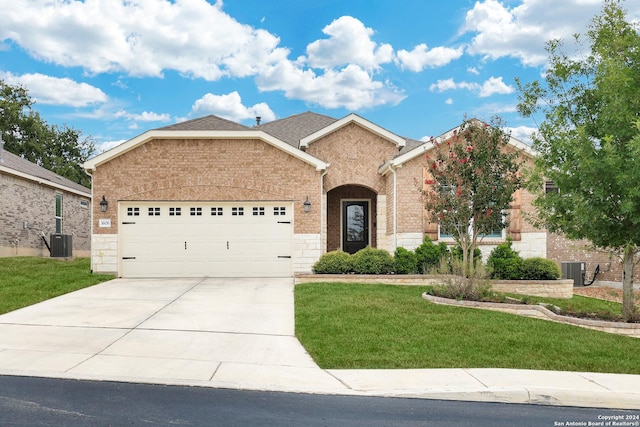 single story home featuring central AC unit, a garage, brick siding, concrete driveway, and a front yard