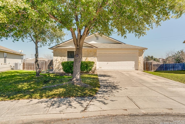 ranch-style home with stone siding, concrete driveway, a front lawn, and central air condition unit