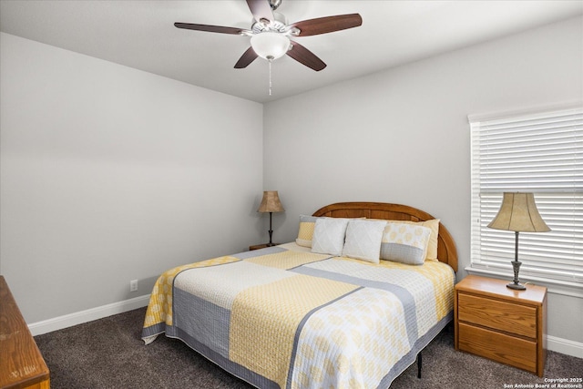 carpeted bedroom featuring a ceiling fan and baseboards