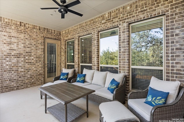 view of patio / terrace featuring ceiling fan and an outdoor living space