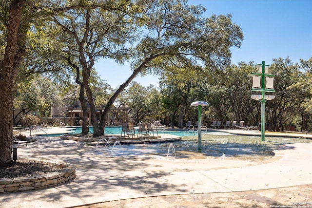 view of home's community featuring a swimming pool