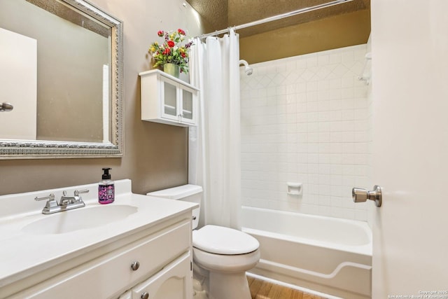 bathroom featuring vanity, toilet, and shower / tub combo with curtain