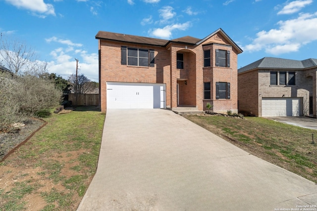 traditional-style home with an attached garage, a front lawn, concrete driveway, and brick siding