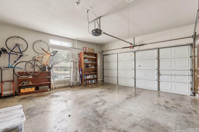 garage featuring a garage door opener