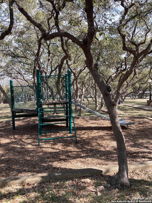 view of home's community featuring playground community