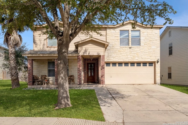 traditional-style home with stone siding, a front yard, concrete driveway, and an attached garage