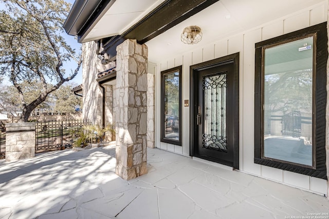 entrance to property with stone siding